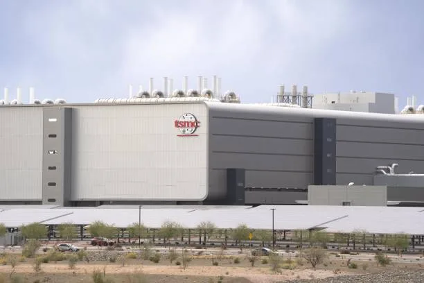 A gleaming, high-tech semiconductor fabrication plant, symbolizing the global shift in manufacturing