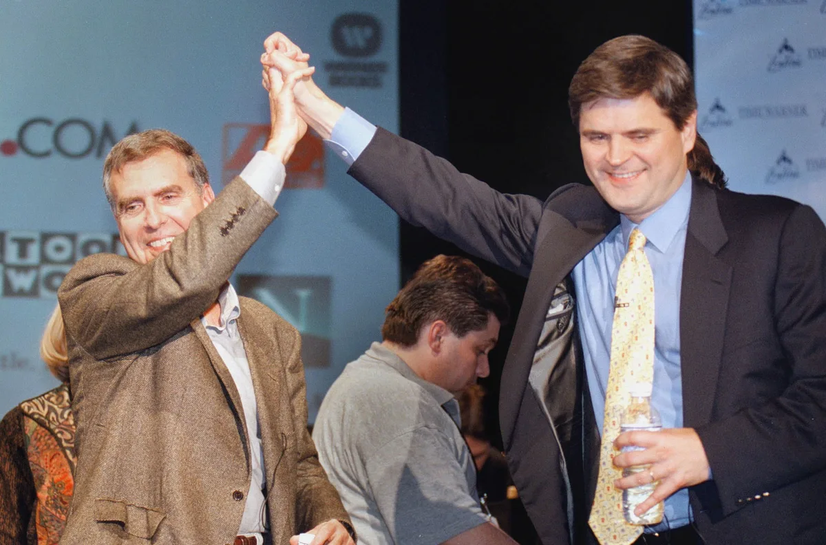 AOL CEO Steve Case and Time Warner CEO Gerald Levin announce their historic $164 billion merger on J