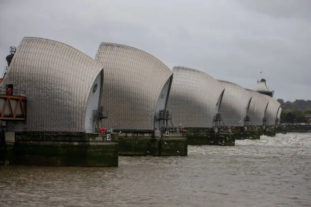 The Thames Barrier, a movable flood control structure, protects London from tidal surges. Since its 