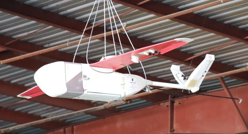A Zipline drone delivering medical supplies in Rwanda, an example of advanced logistics transforming cross-border commerce.