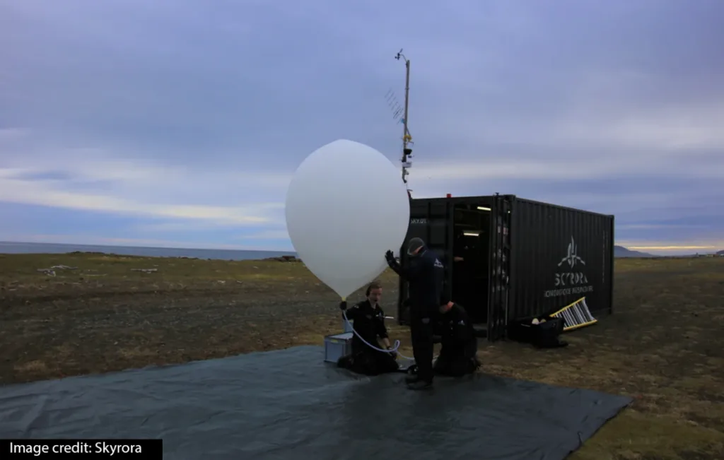A weather balloon ascends into the atmosphere, carrying a radiosonde to collect vital data on temper