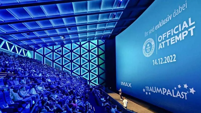 IMAX theaters, known for their massive screens and specialized projection systems, are a prime examp