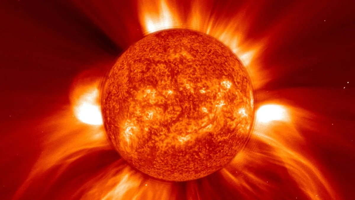 A massive solar flare erupts from the Sun, often accompanied by a Coronal Mass Ejection (CME). These