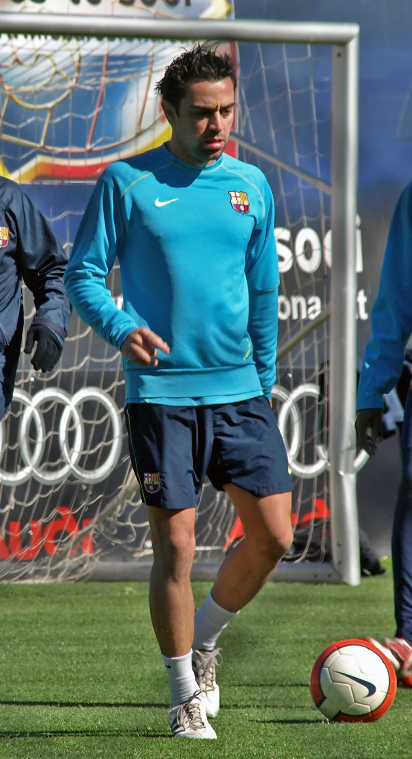 Xavi Hernández training with FC Barcelona, showcasing his trademark ball control