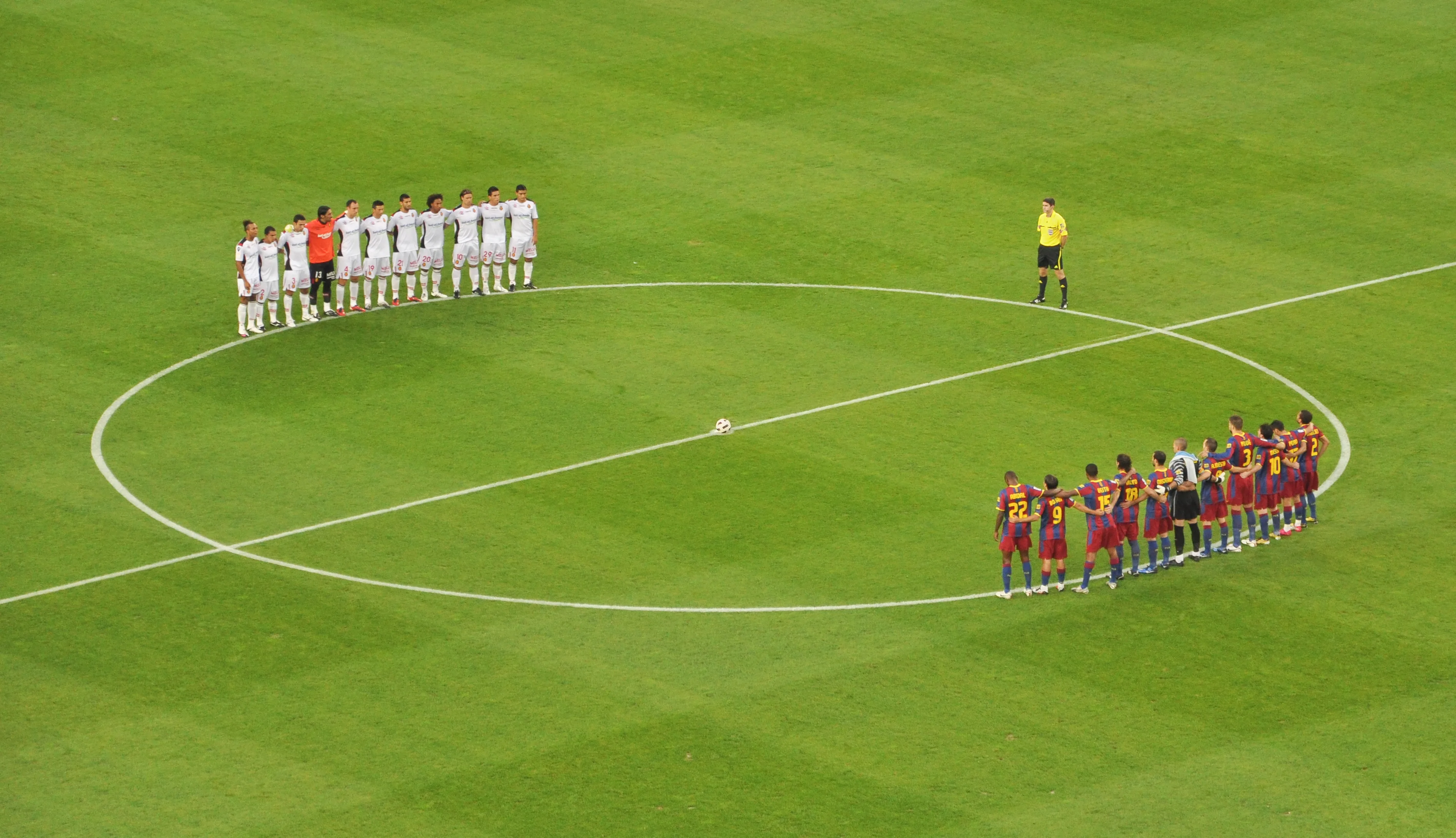 Barcelona and Mallorca teams lined up at Camp Nou before a La Liga match